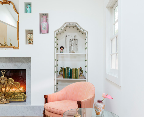 Touch Interiors reading room with pink chair