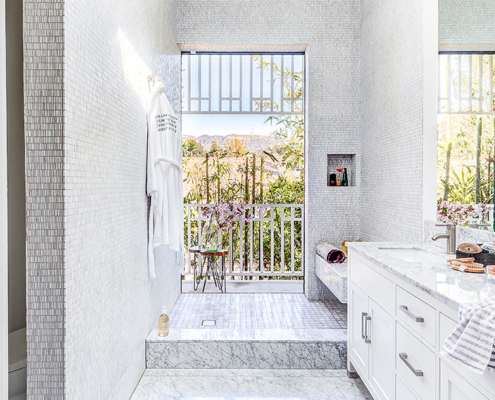 Touch Interiors white mosaic bathroom with view of Hollywood sign