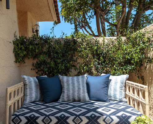 Thibaut outdoor fabric on concrete bamboo look sofa