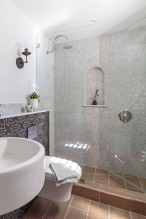 Small spaces bathroom remodel with tumbled stone tiled mosaic wall
