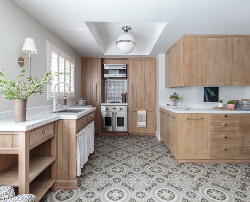 Touch-Interiors-Kitchen design wood cabinets sink curtain pattern tile floor