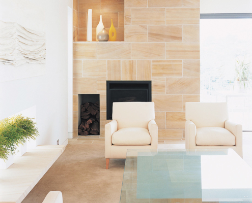 Smooth sandstone fireplace with Jardan armchairs