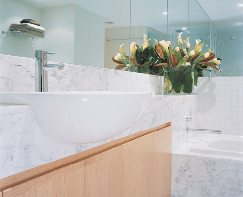 Touch Interiors by Bronwyn Poole Waverton project guest bathroom with carrara marble counter and american oak cabinets