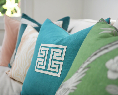 Luxury pillow detail with Greek key design and velvet