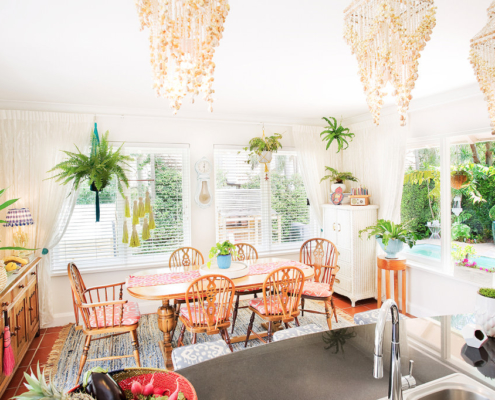 Boho kitchen with hanging shell pendants and hanging plants